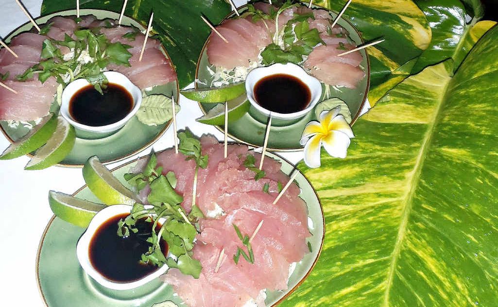 A sashimi-style raw fish dish A sashimi-style raw fish dish